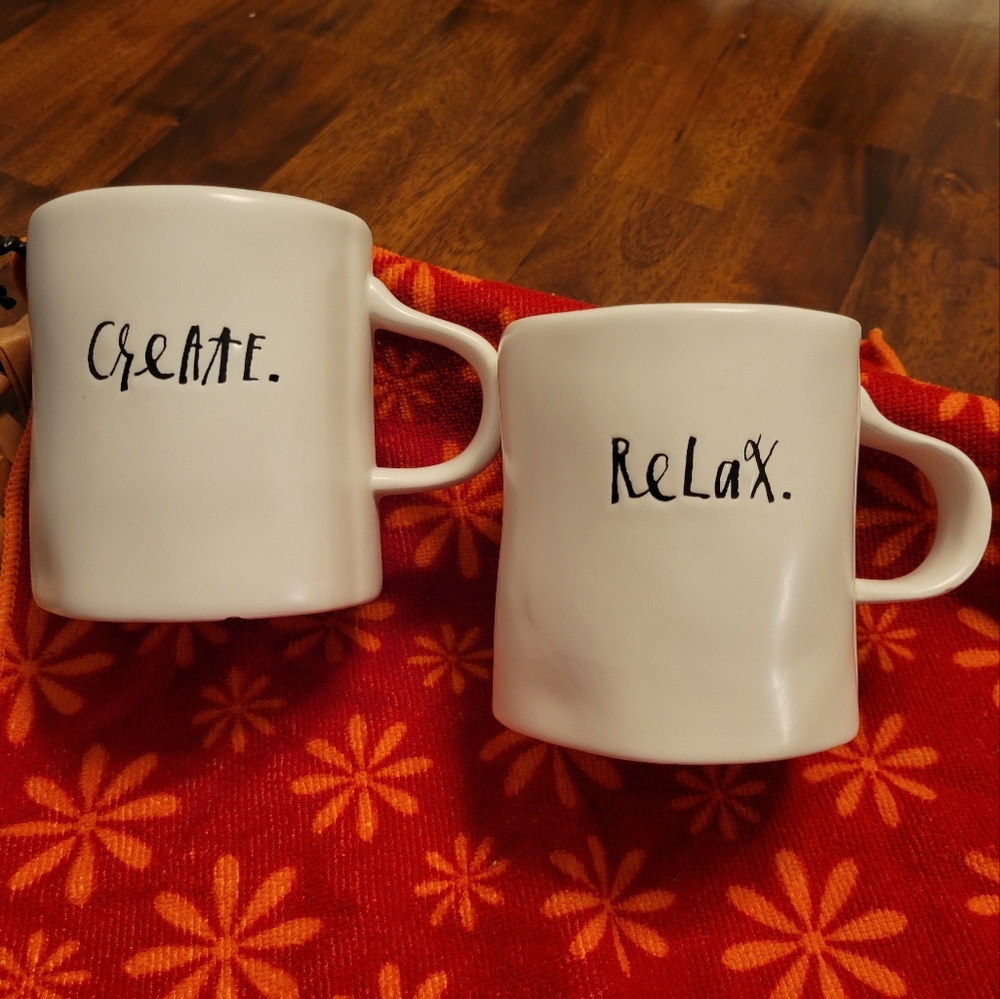 Two 12 oz mugs of Rae Dunn "CREATE" and "RELAX" mugs.